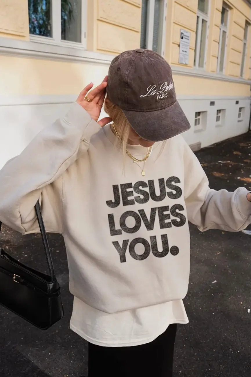 NEW!! “Jesus Loves You" Sweatshirt in Sand sold by Glitzy Bella