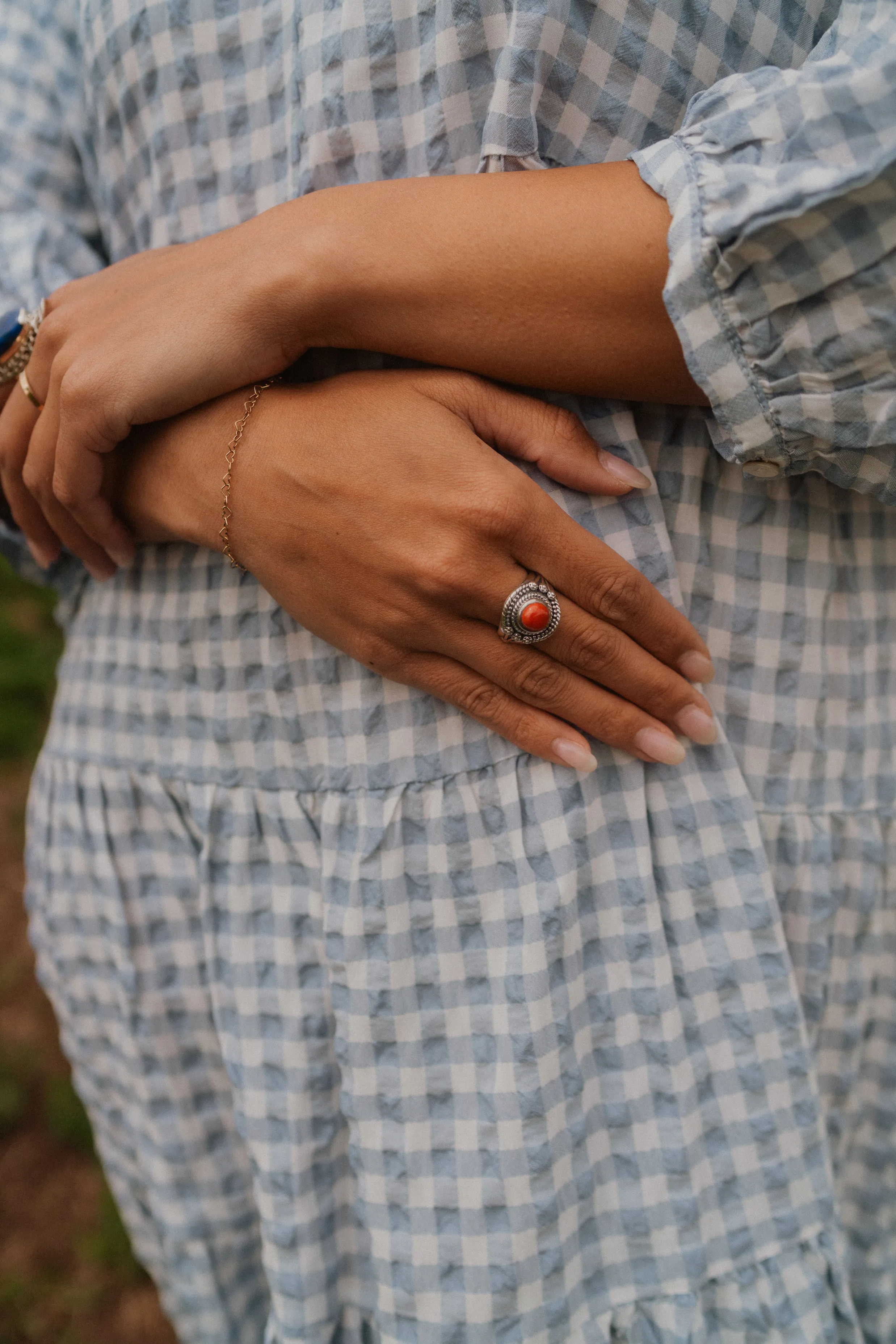 Reaching for Red Ring | Coral sold by Goldie Lew