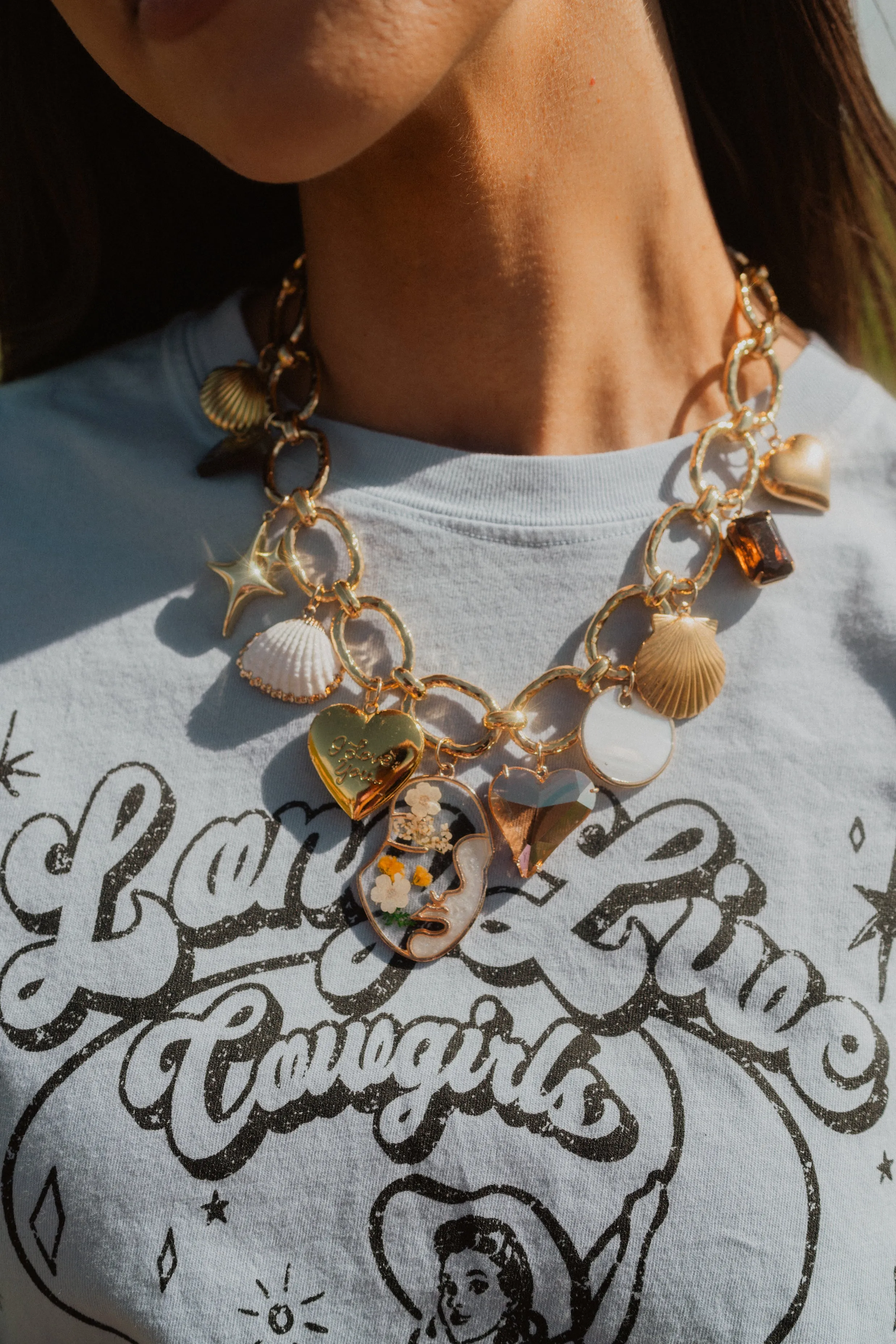 Golden Seashells Charm Necklace sold by Goldie Lew