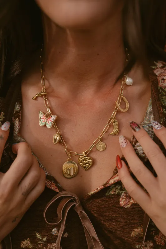 Butterflies + Boots Necklace sold by Goldie Lew