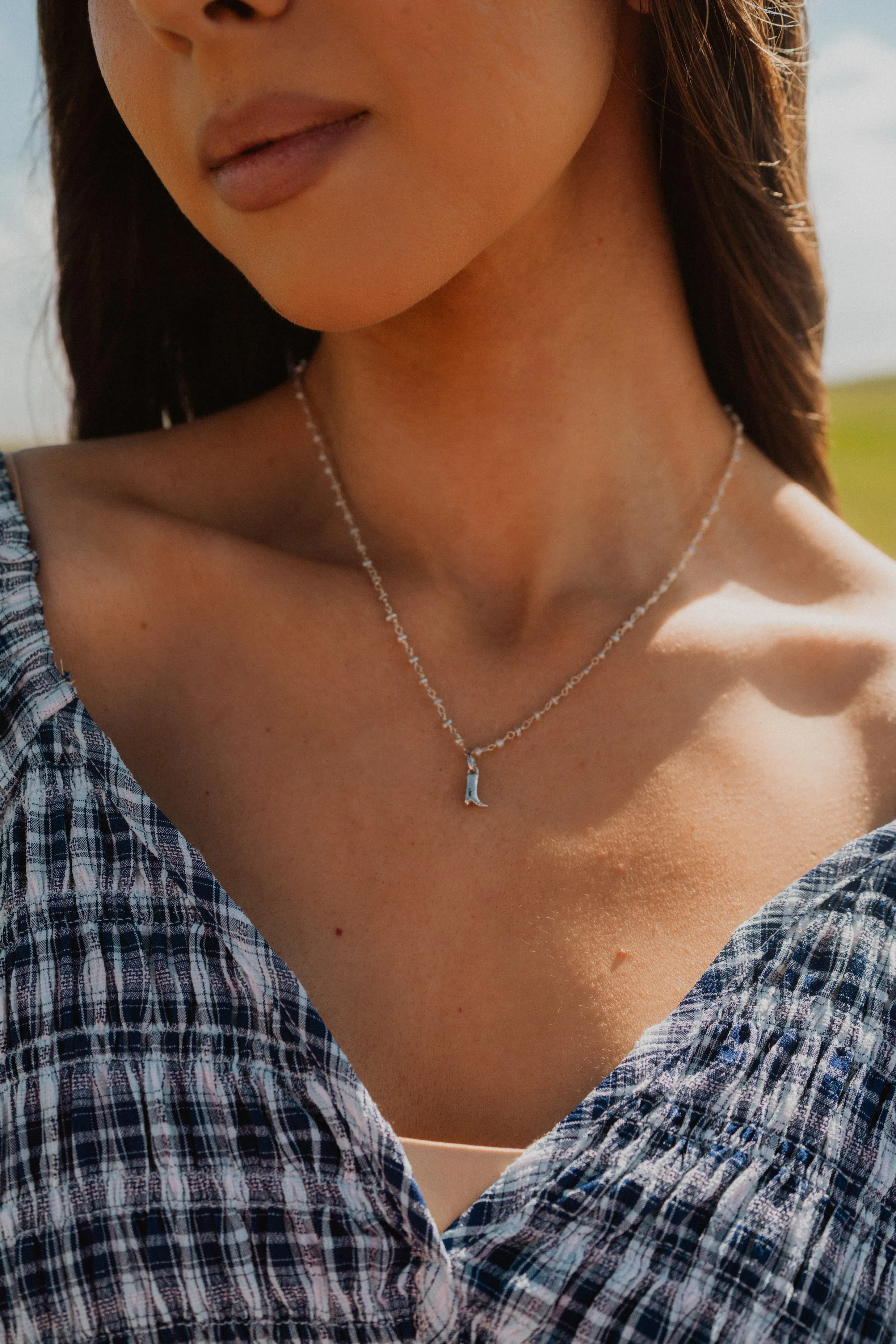 Silver Shoes Necklace sold by Goldie Lew