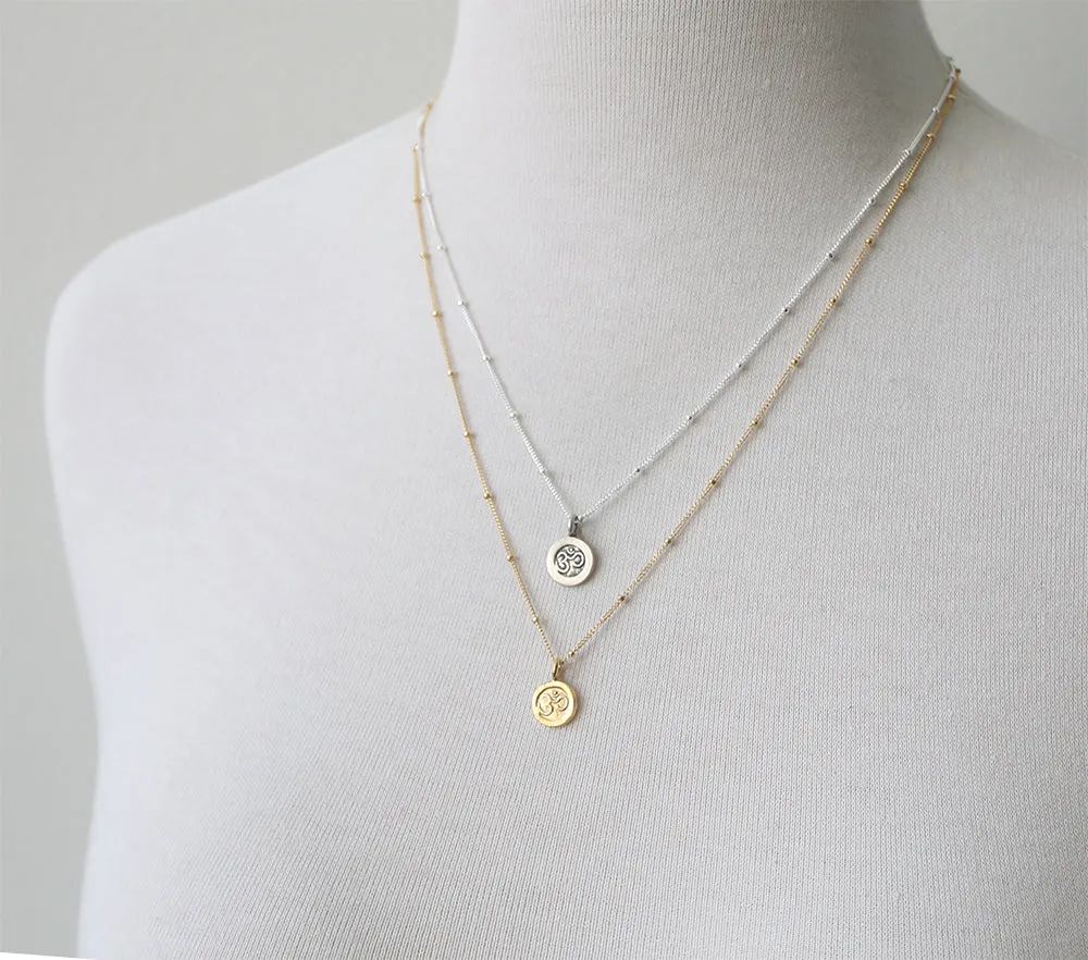 Tiny Om Necklace sold by Peggy Li Creations product image thumbnail 3