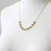 Filigree Ball Necklace sold by Peggy Li Creations