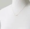 Sideways Cross Necklace sold by Peggy Li Creations
