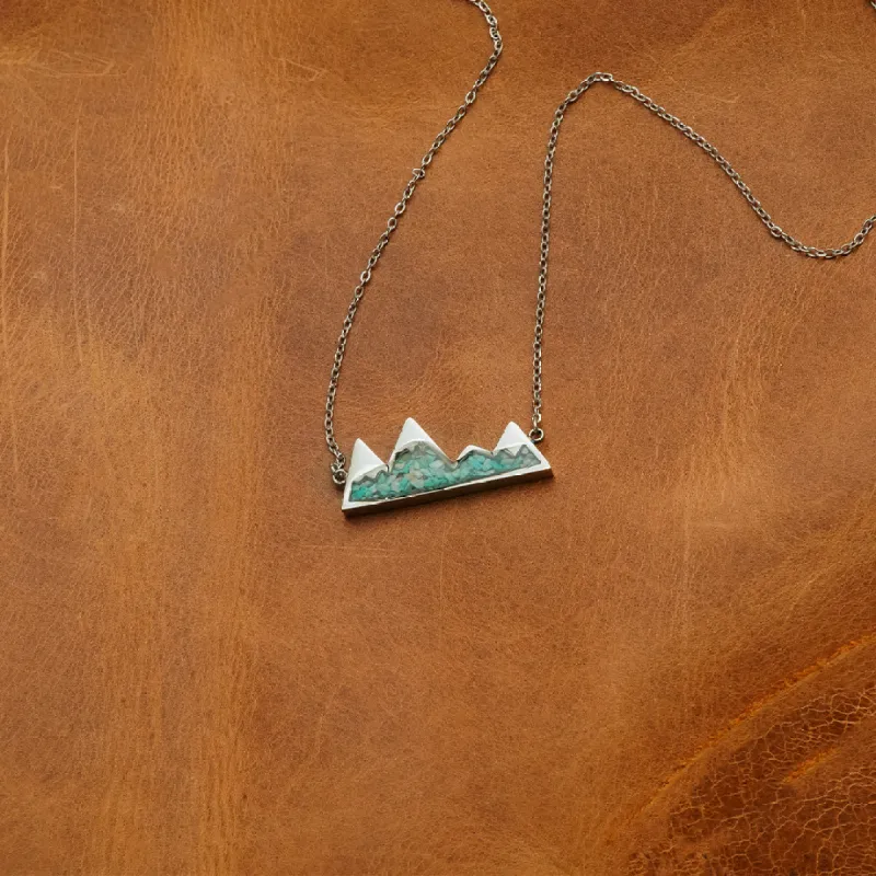 The Turquoise Mountain Range sold by Antler Rings