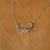 The Antler & Floral Necklace sold by Antler Rings