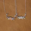 The Antler & Floral Necklace sold by Antler Rings