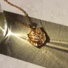 Psyche's Journey Charm Lariat sold by Awe Inspired