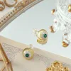 Emerald Flower Earrings sold by Selenichast