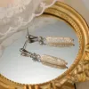 Long Baroque Pearl Earrings sold by Selenichast