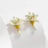 Gardenia Earrings sold by Selenichast