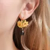 Gardenia Dangling Earrings sold by Selenichast