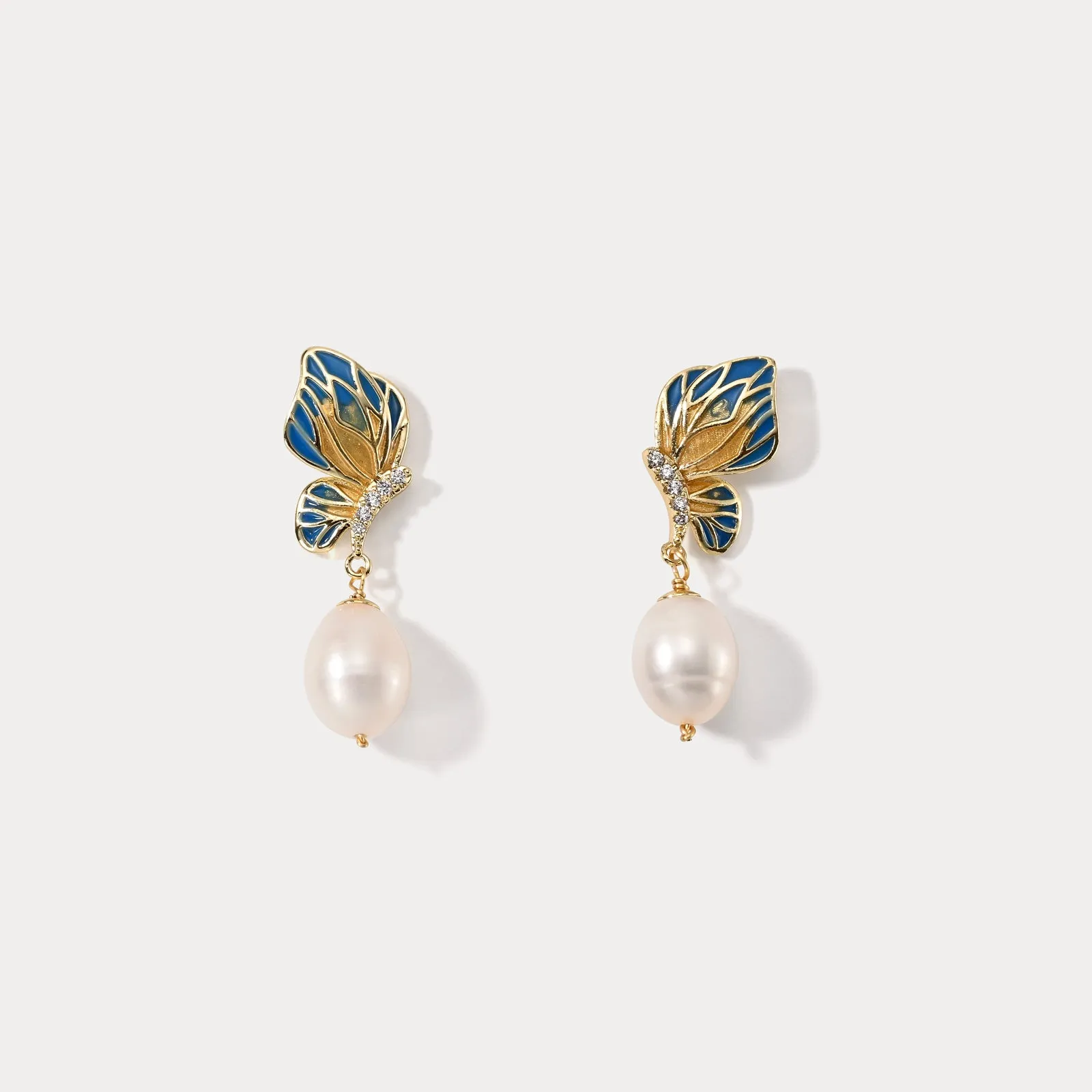 Butterfly Pearl Dangling Earrings sold by Selenichast