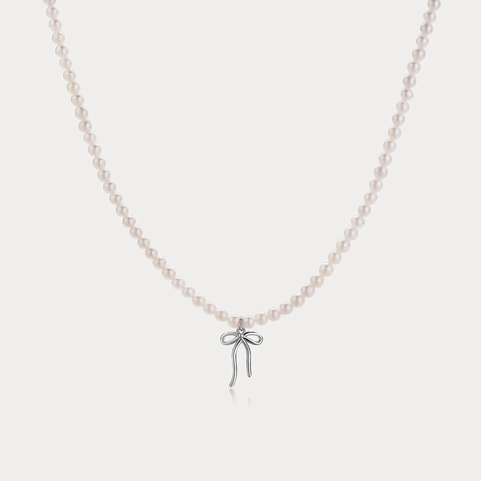 Pearl Bow Necklace sold by Selenichast