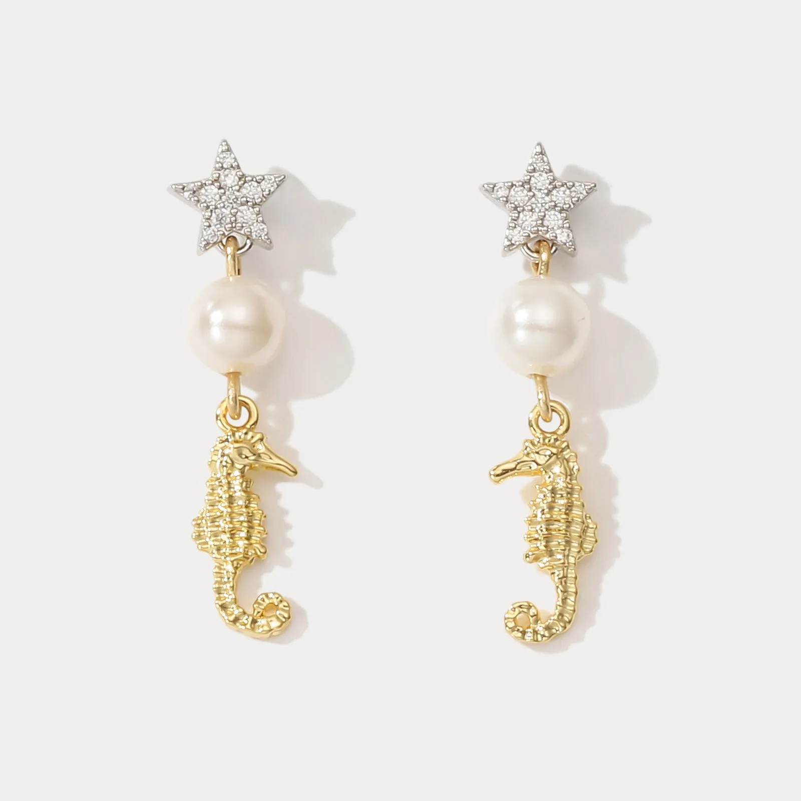 Seahorse Star Earrings sold by Selenichast