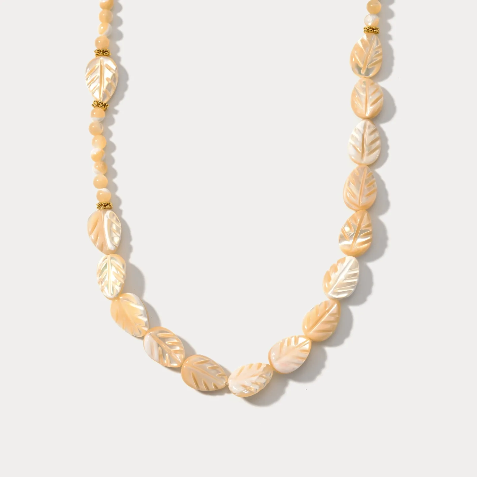 Carved Mother of Pearl Leaf Bead Necklace sold by Selenichast