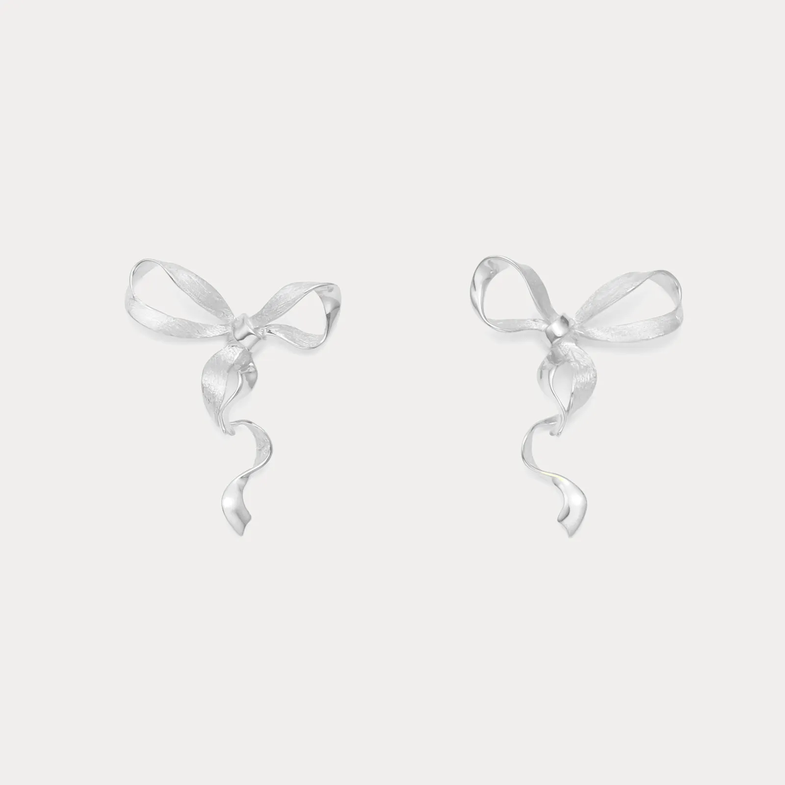 Silver Bow Earrings sold by Selenichast
