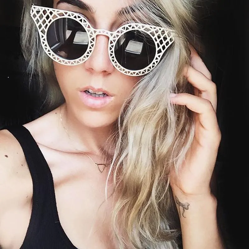 Women's Laser Cut Metal Criss Cross Cat Eye Sunglasses sold by ZeroUV