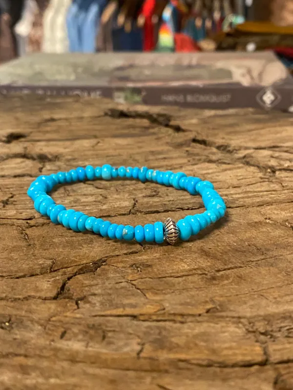 Sleeping Beauty Turquoise Mixed Rondelle Bead Stretch Bracelet with Sterling Silver Bead sold by Cave and Post