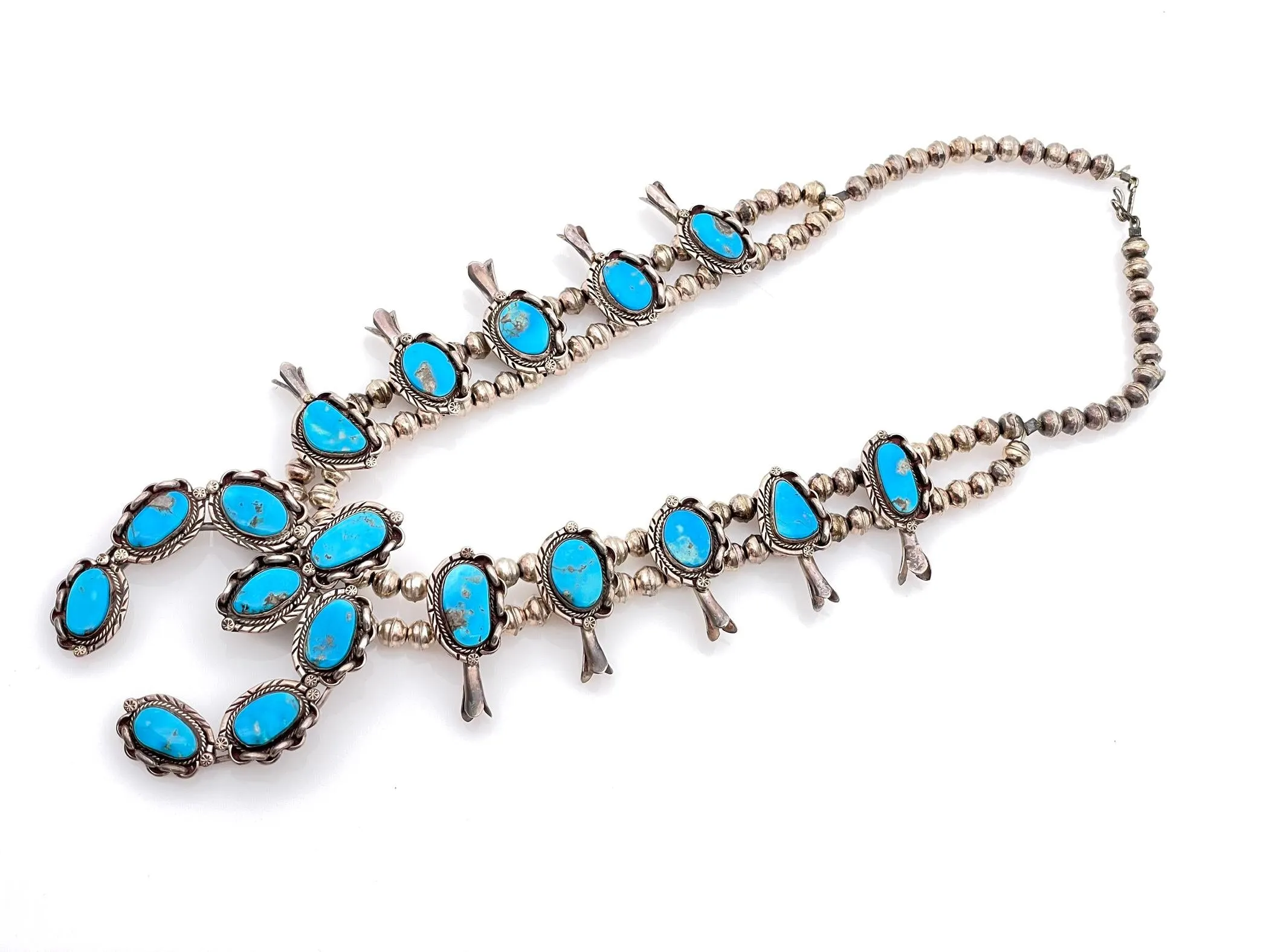NATIVE AMERICAN STERLING SILVER TURQUOISE SQUASH BLOSSOM NECKLACE sold by Cave and Post