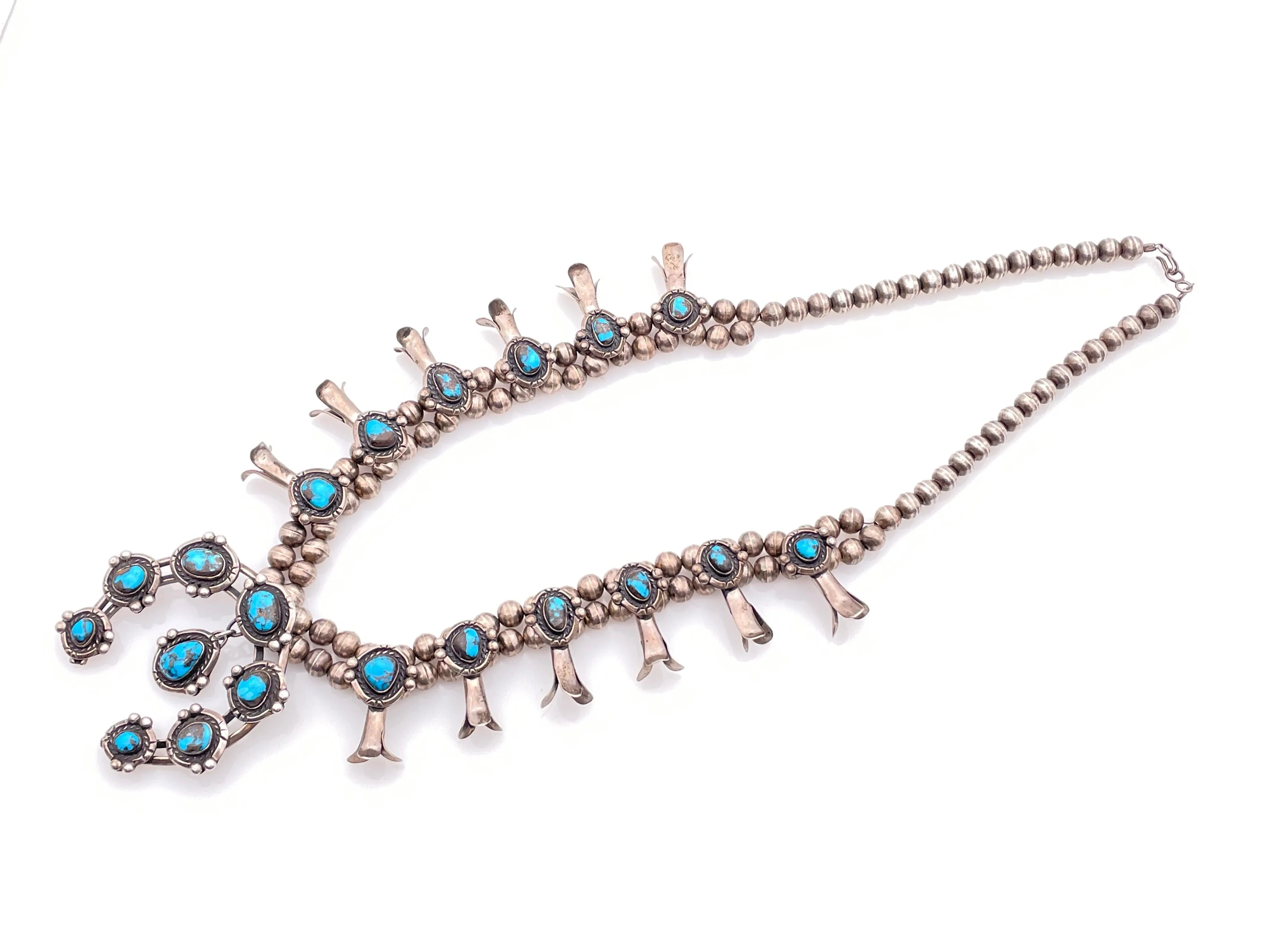 RARE! NATIVE AMERICAN STERLING SILVER BISBEE TURQUOISE SQUASH BLOSSOM NECKLACE sold by Cave and Post