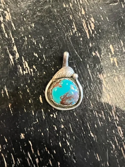 Signed Sterling and Turquoise Pendant sold by Cave and Post