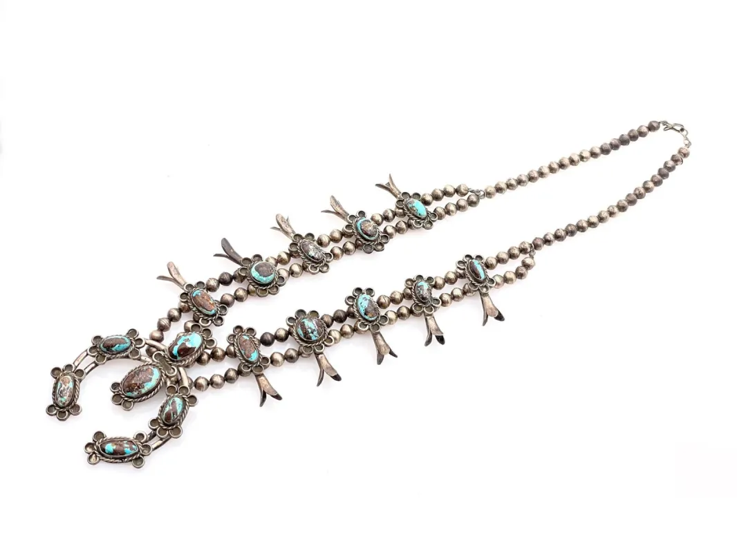 VINTAGE NATIVE AMERICAN STERLING SILVER TURQUOISE SQUASH BLOSSOM NECKLACE sold by Cave and Post