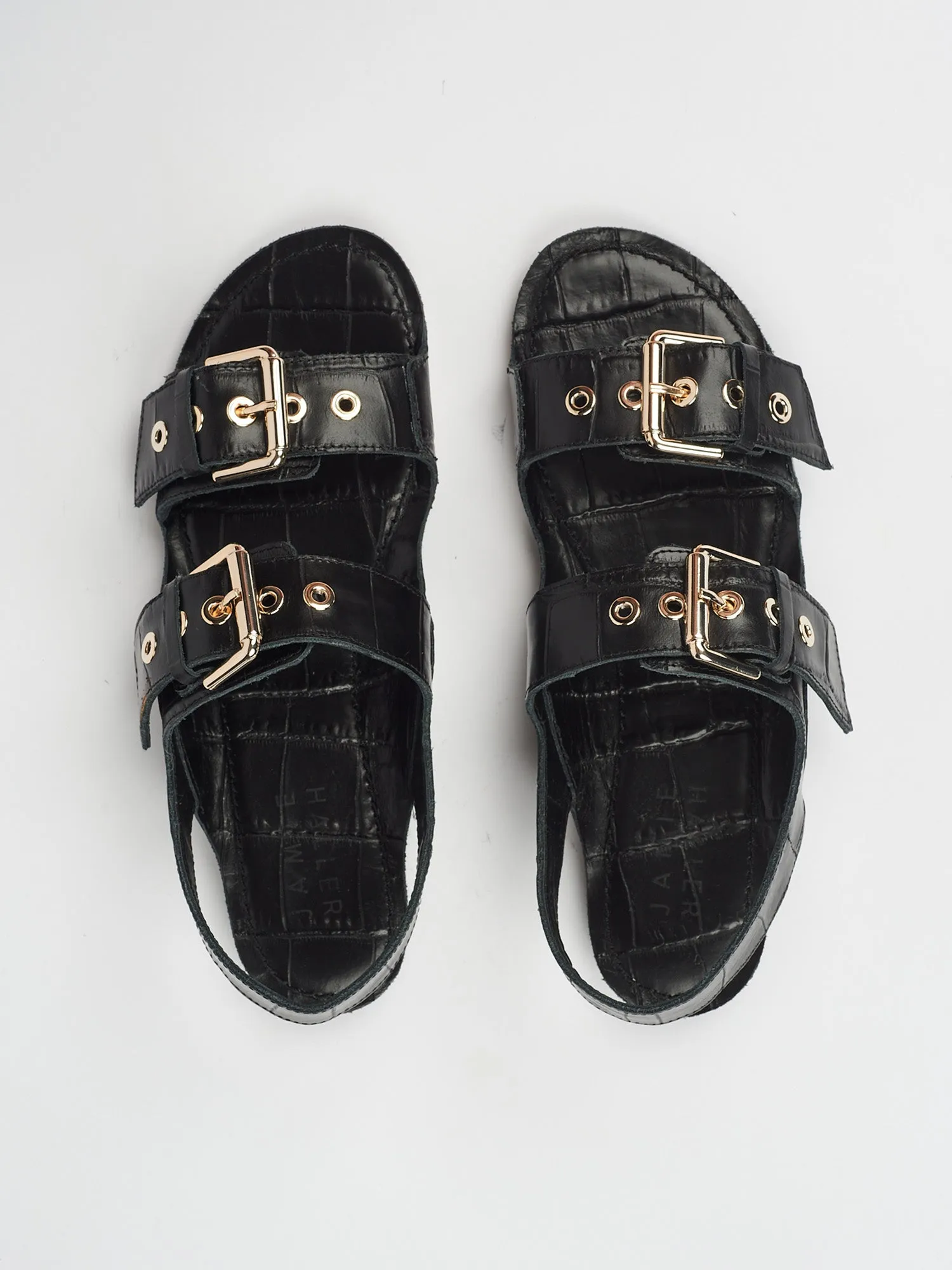The Double Buckle Sandal in Black Croc sold by Jamie Haller