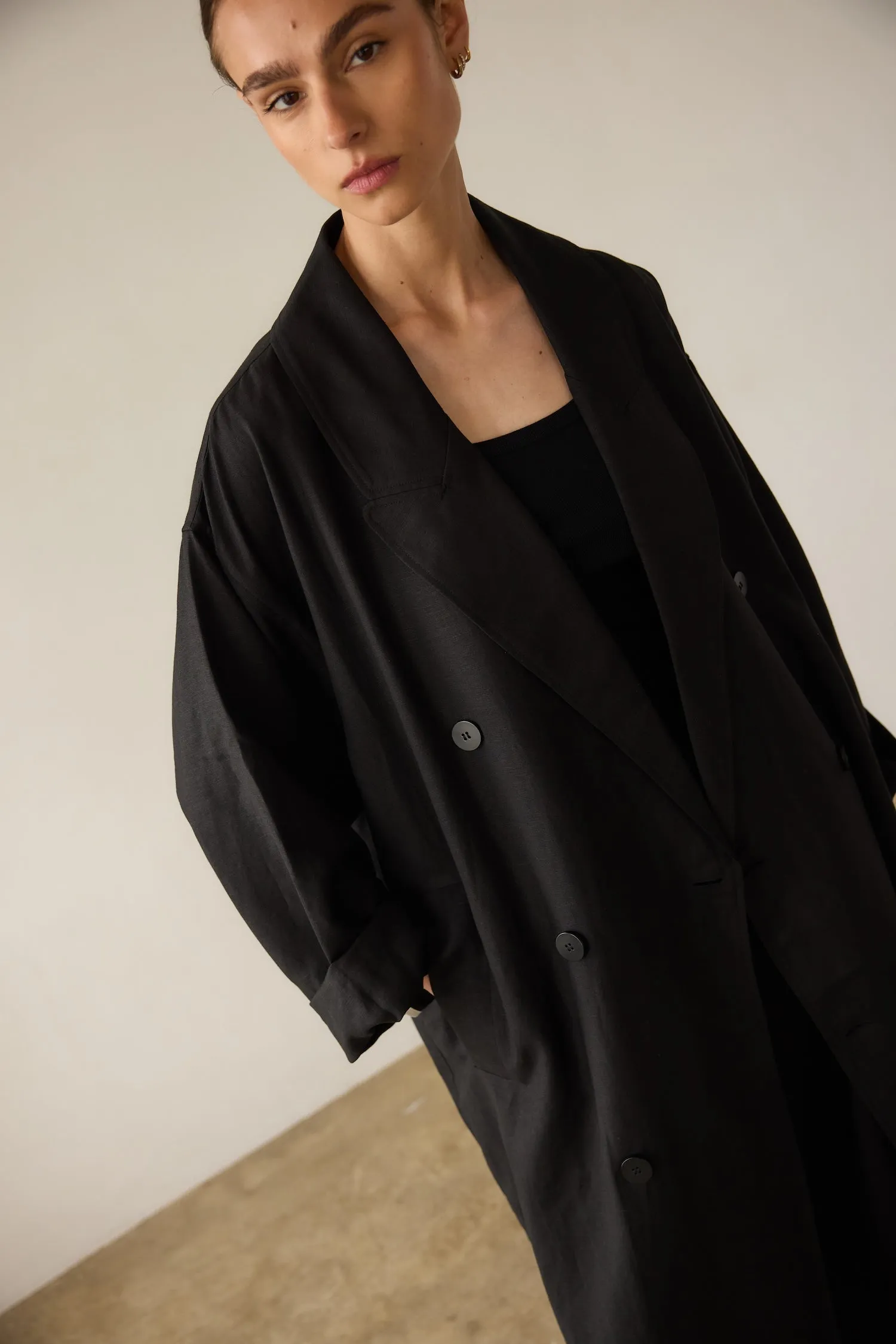 The Linen Baggy Trench Coat in Black sold by Jamie Haller
