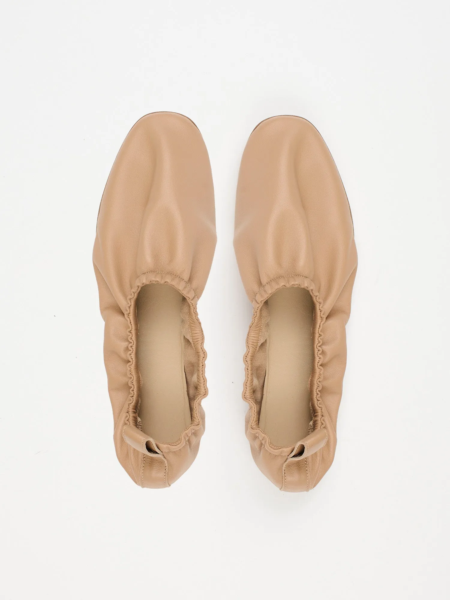 The Elastic Slipper in Dark Caramel sold by Jamie Haller