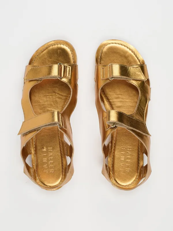 The Walking Sandal in Metallic Bronze sold by Jamie Haller