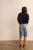 The Cut Knee Short in Worn Indigo sold by Jamie Haller