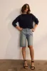 The Cut Knee Short in Worn Indigo sold by Jamie Haller