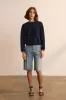The Cut Knee Short in Worn Indigo sold by Jamie Haller