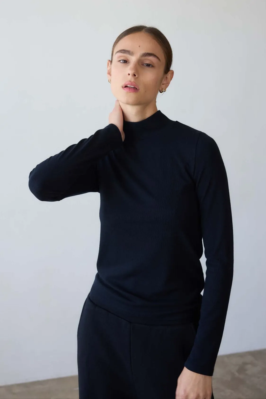 The Mock Neck in Black sold by Jamie Haller
