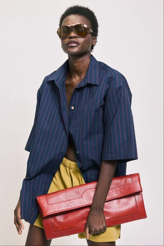 The Document Clutch in Red Snake sold by Jamie Haller