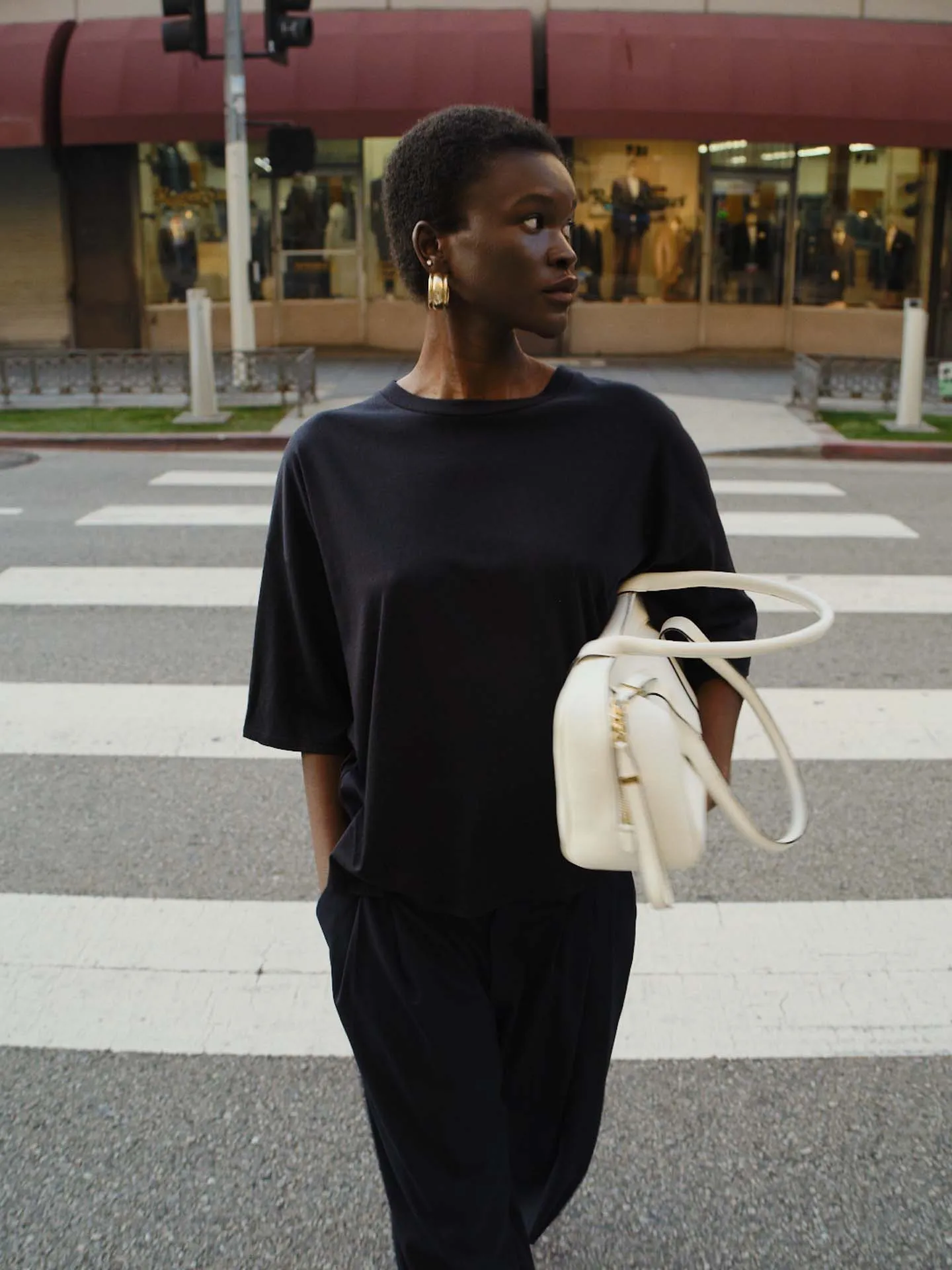 The Draped Tee in Black sold by Jamie Haller