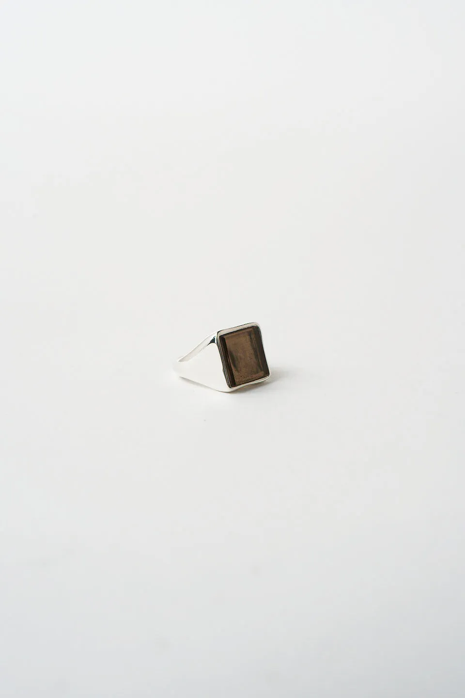 The Nina Flat Signet Ring in Smoky Quartz sold by Jamie Haller