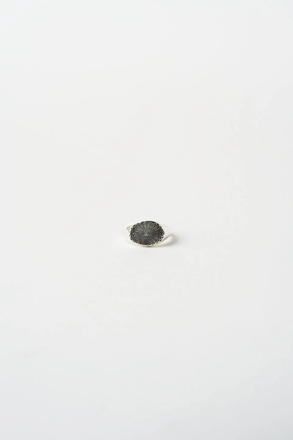 The Chaos Sunburst Oval Signet in Sterling Silver sold by Jamie Haller