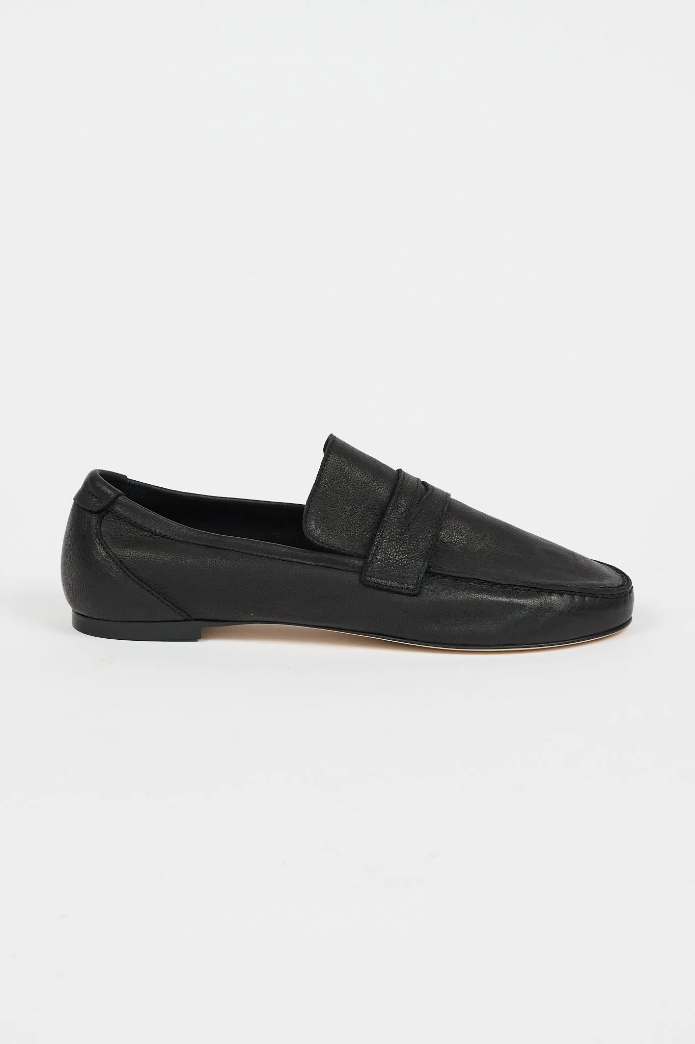 The Unlined Penny Loafer in Nero sold by Jamie Haller