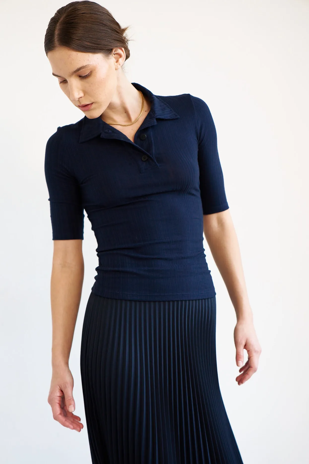 The Slim Polo Tee in Navy sold by Jamie Haller