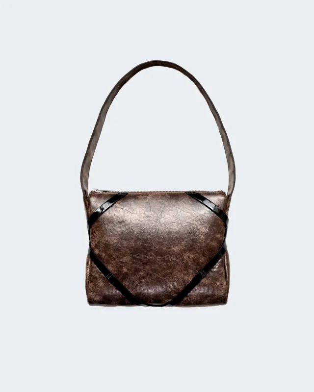 The Pillow Bag in Dark Brown sold by Puppets and Puppets