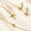 Floral Cross Tulip Hoop Earrings sold by Vanimy Jewelry