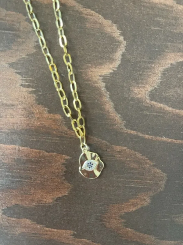 hammered evil eye coin pendant necklace sold by bubs & sass
