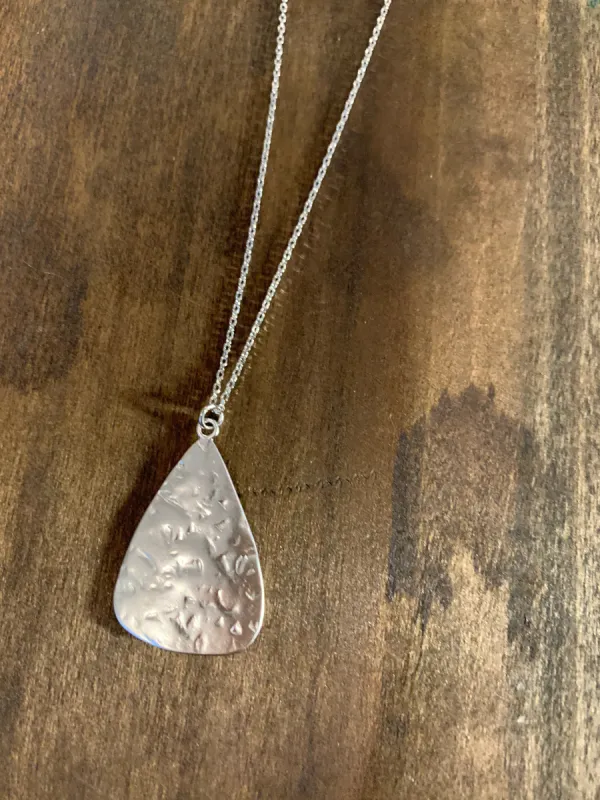 hammered matte triangle pendant necklace sold by bubs & sass