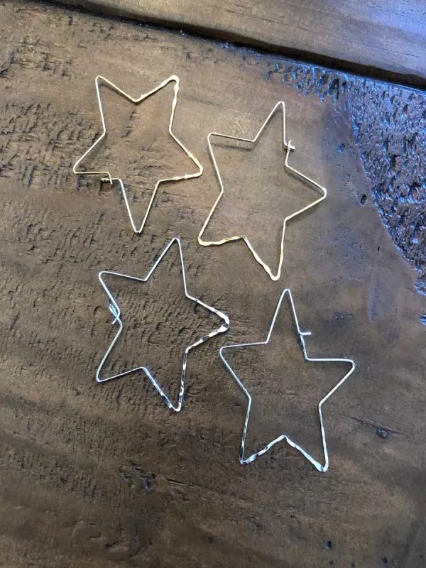 hammered star wire earrings sold by bubs & sass