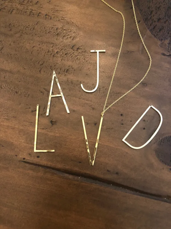large hammered initial necklace sold by bubs & sass