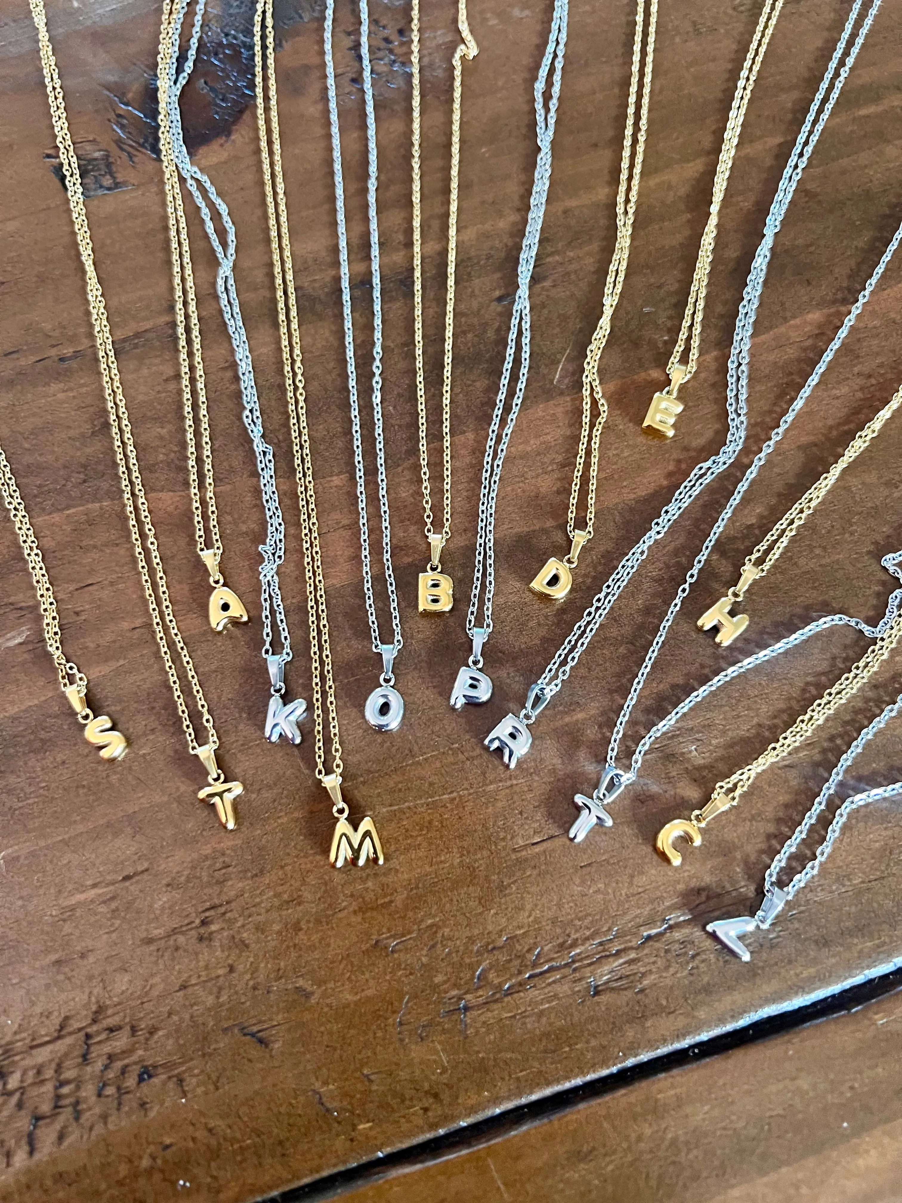 tiny bubble letter initials sold by bubs & sass