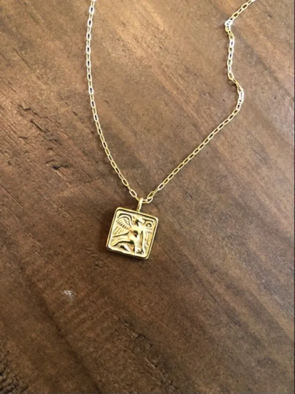 angel coin necklace sold by bubs & sass