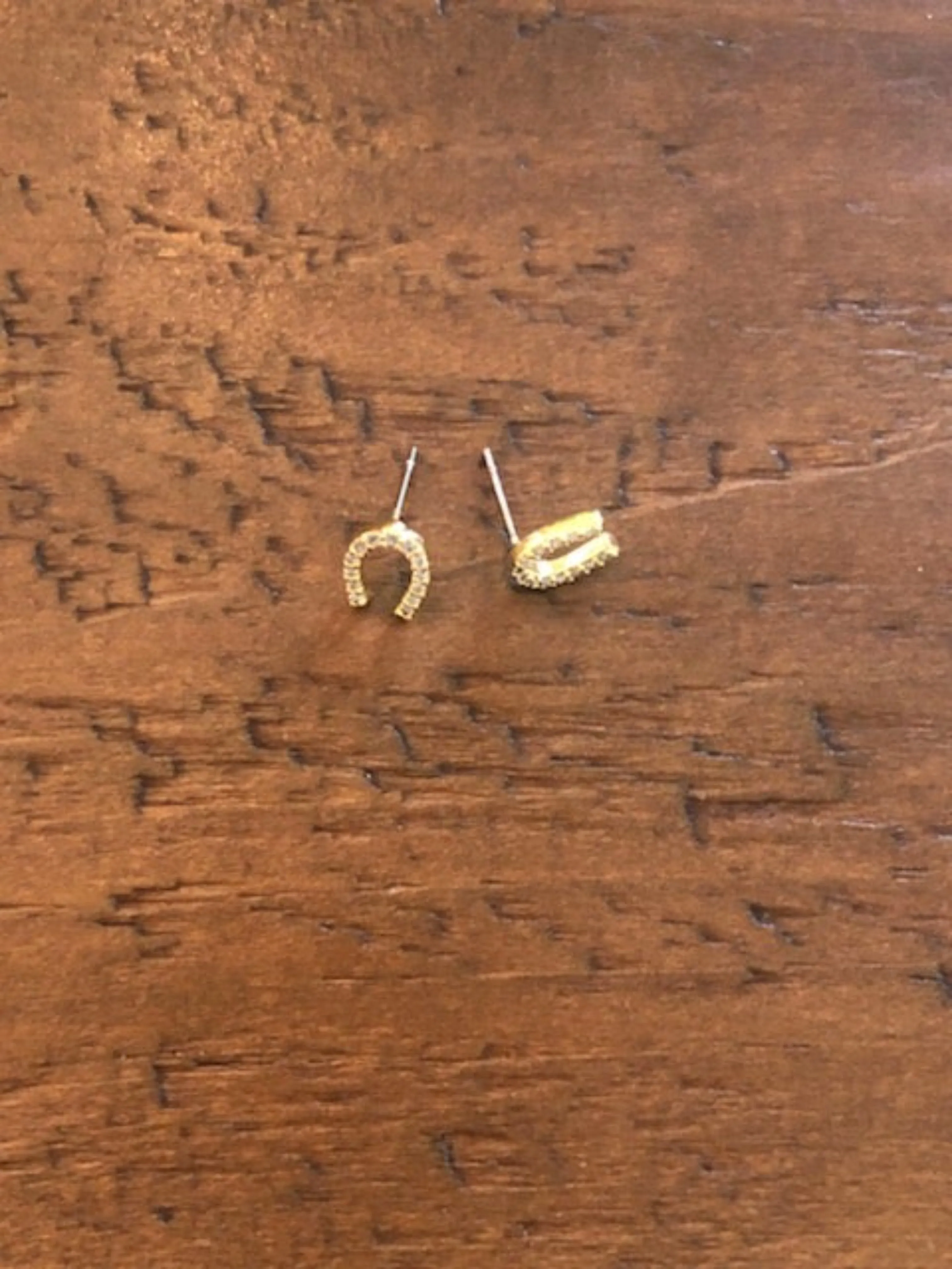 cz lightning bolt/horseshoe stud earrings sold by bubs & sass